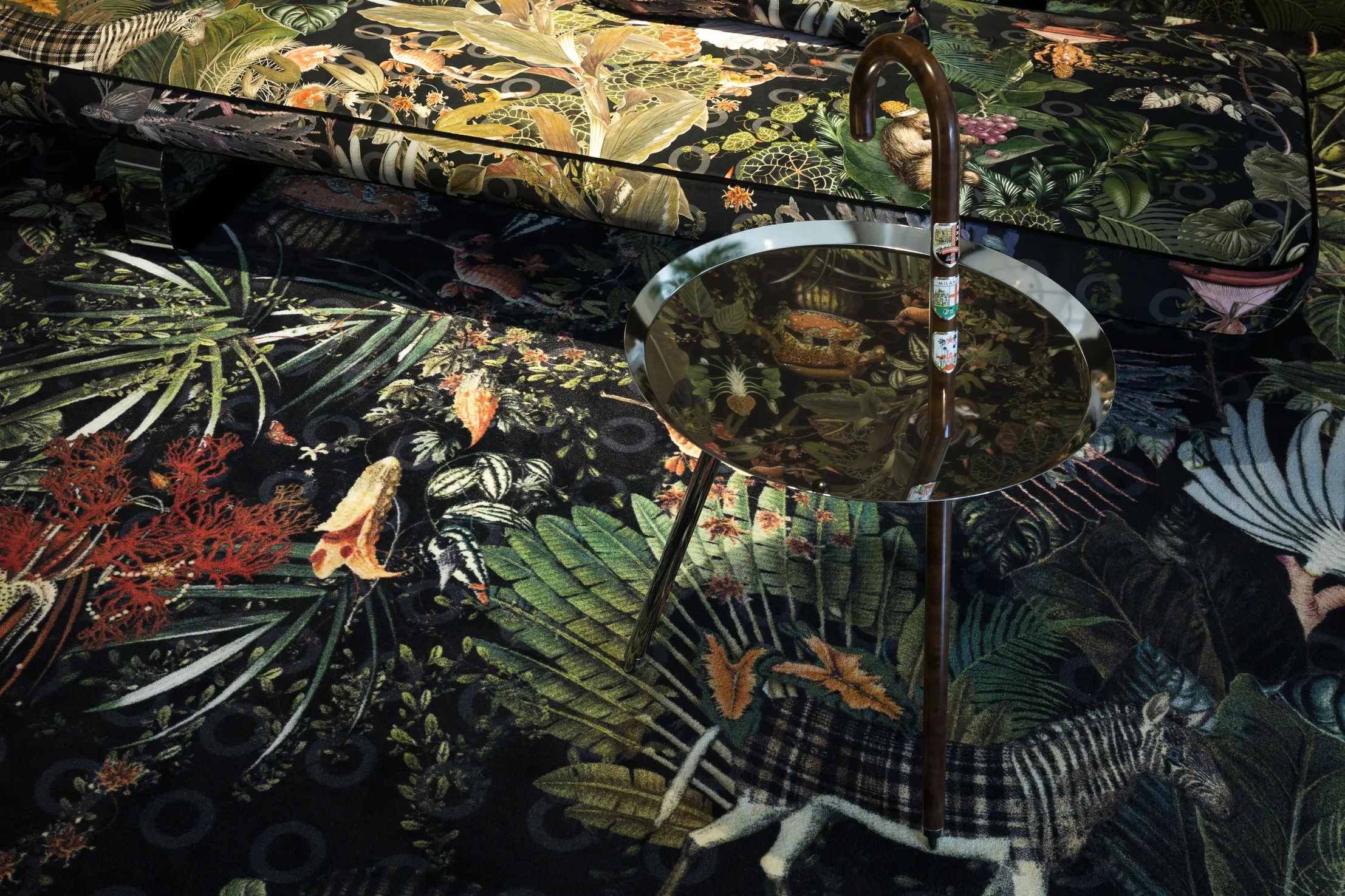 Menagerie of Extinct Animals Raven on carpet and Power Nap sofa